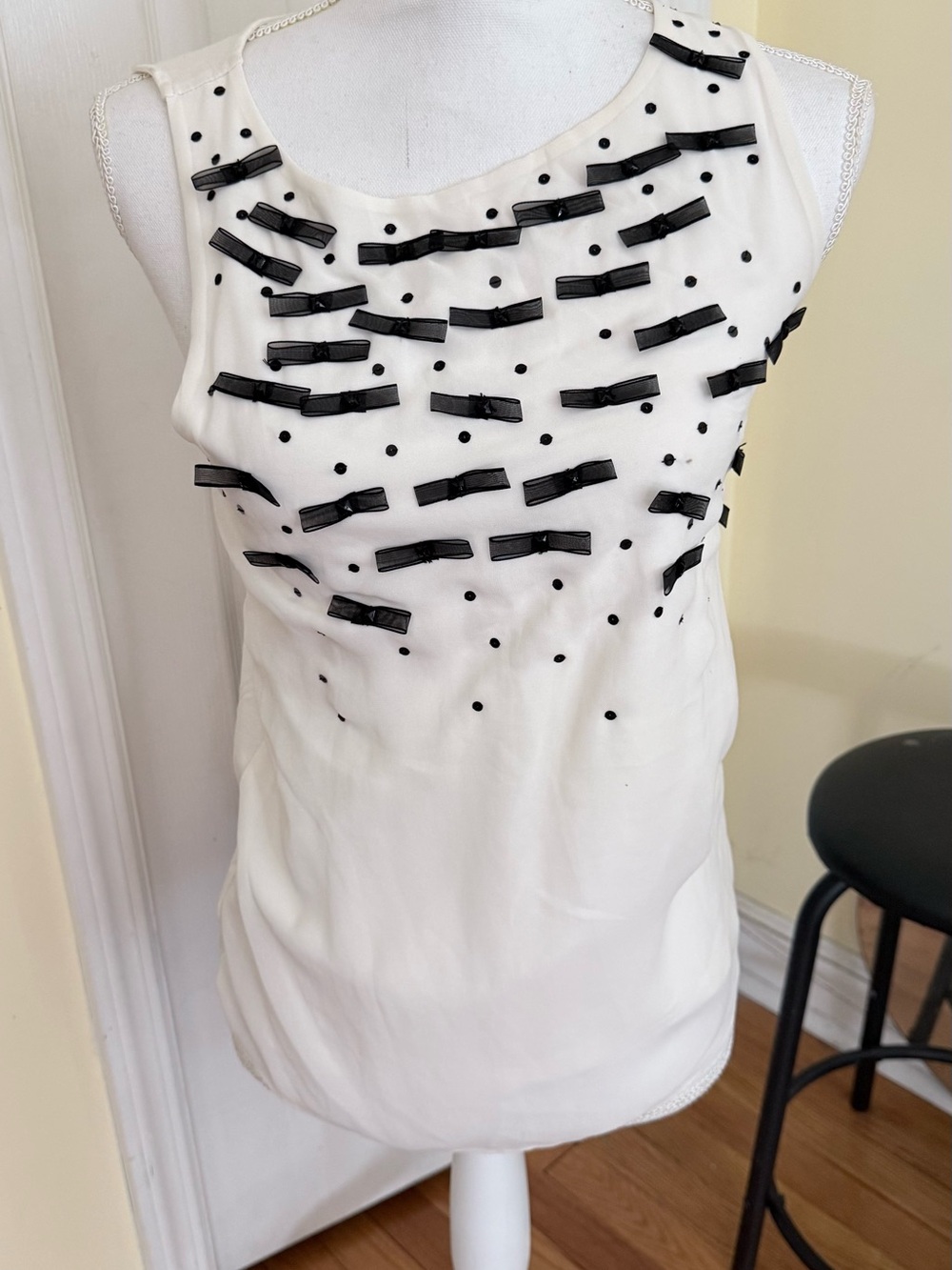 Women's White Sleeveless Top with Black Bow Accents